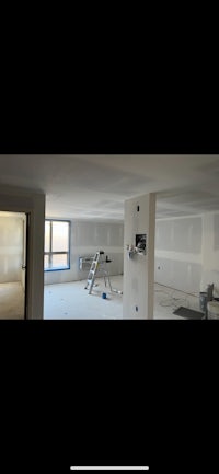 a room that is being remodeled with white walls