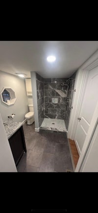 a bathroom with a shower and a sink