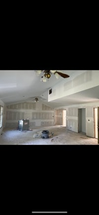 a room that is being remodeled with a ceiling fan