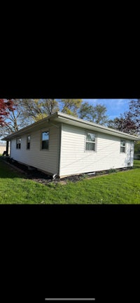 an image of a house with a grassy yard