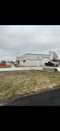 a building with a parking lot in front of it