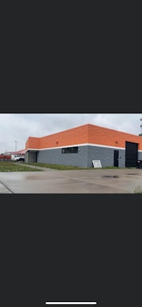 a photo of a building with an orange roof