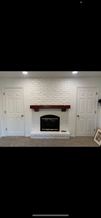 a white brick fireplace in a living room