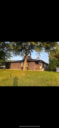 a house with a tree in front of it