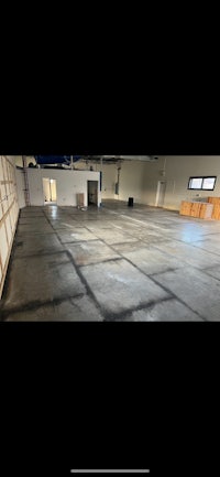 an empty warehouse with a concrete floor