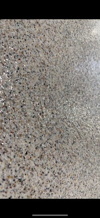 a close up of a concrete floor with a lot of speckles